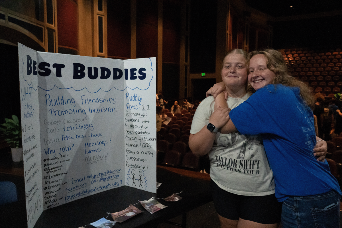Keegan Turner McQuinn(right) visits with Addie Tunis(left) of the Best Buddies club.