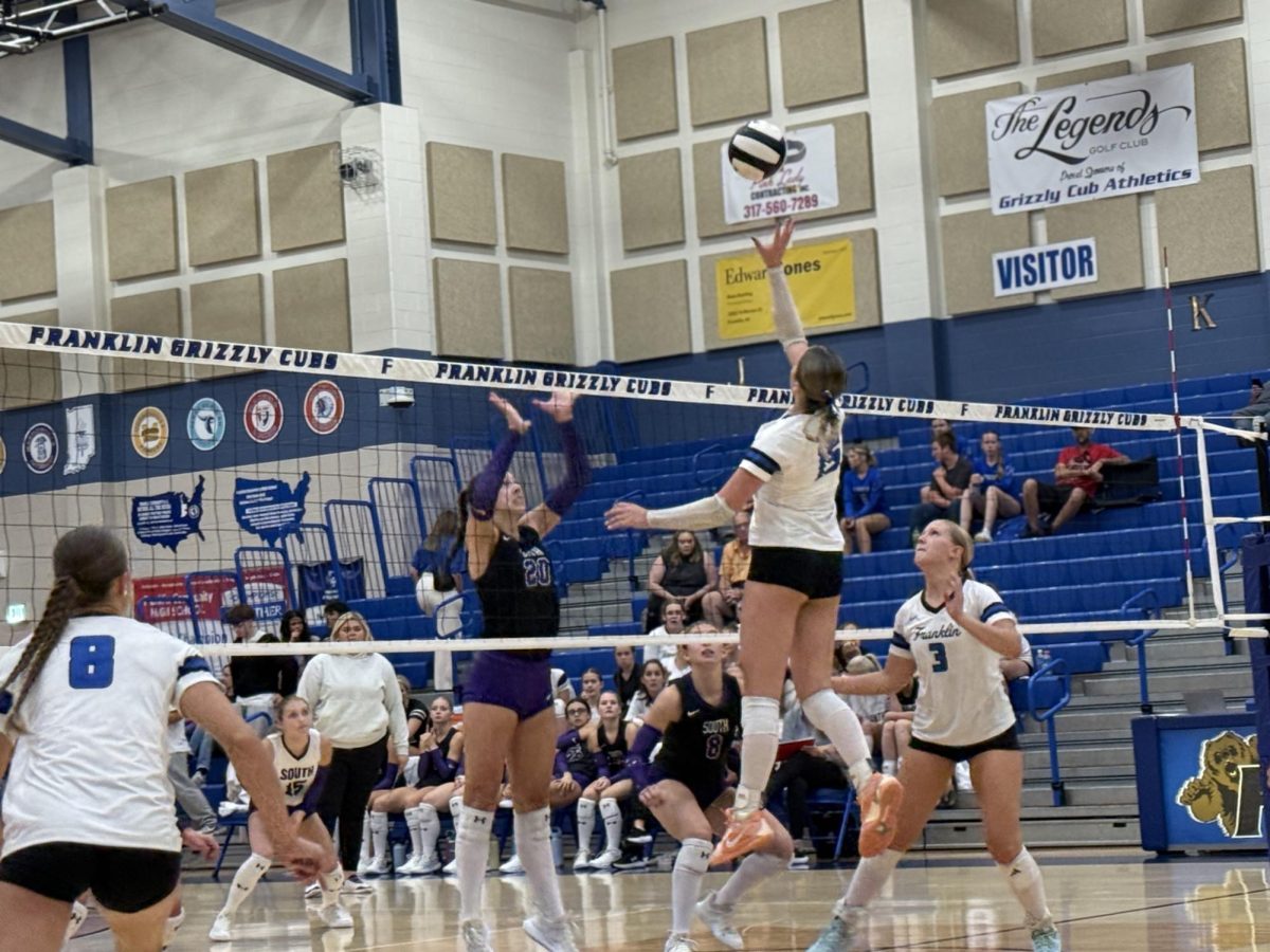 Ava Lilly setting the ball