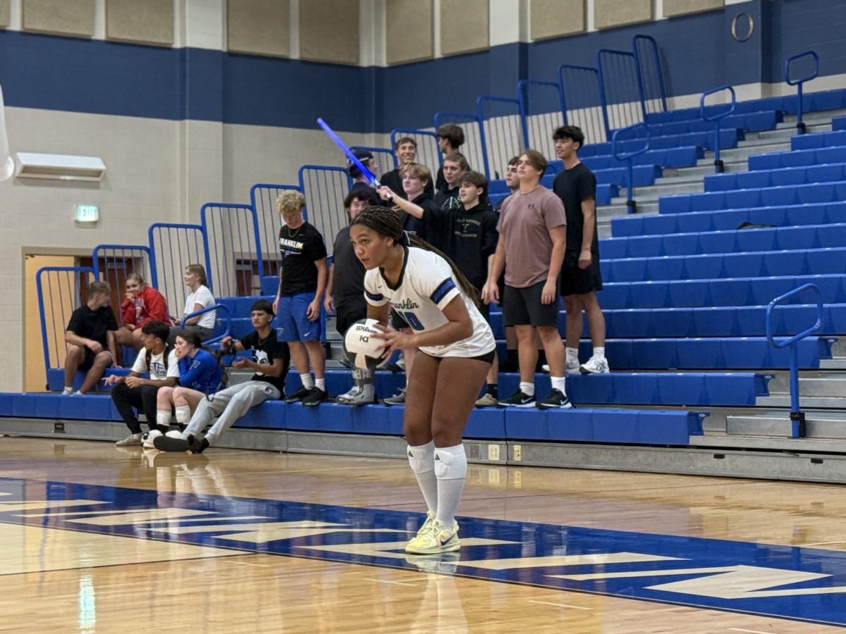 Madi Chase getting ready for a serve
